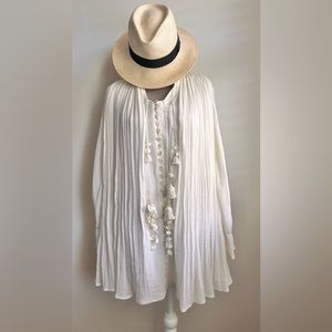 Cream colored mini dress with seashells and tassels